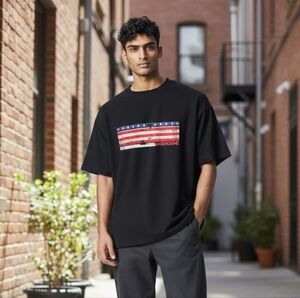 Wolverine Black Tee with Distressed American Flag Graphic